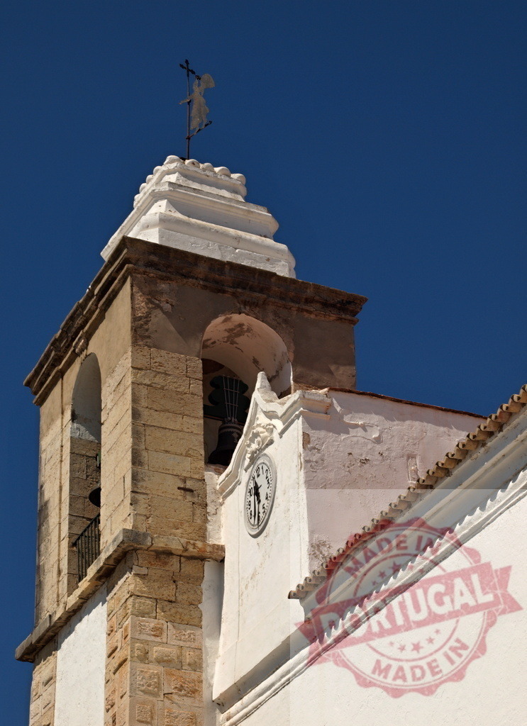 Church bell tower with angel weather vane | Bell tower featuring a clock and angel weather vane against clear blue sky - Realized with Pictrs.com