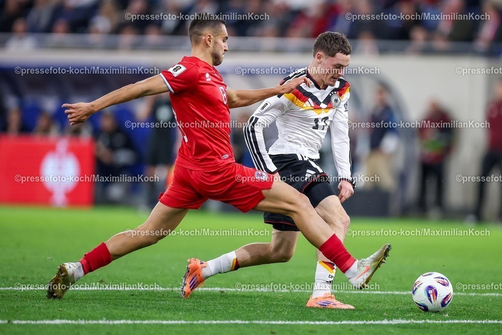 DFB14112501065 | 14.11.2025, Fußball, Länderspiel, WM-Qualifikation Europa, Deutschland - Luxemburg, Stade de Luxembourg (Croix de Gasperich, Luxemburg), 9. Spieltag, Saison 2025 2026: Florian Wirtz (GER #17) im Zweikampf gegen  Dirk Carlson (LUX #13)  Regulations prohibit any use of photographs as image sequences and or quasi-video.