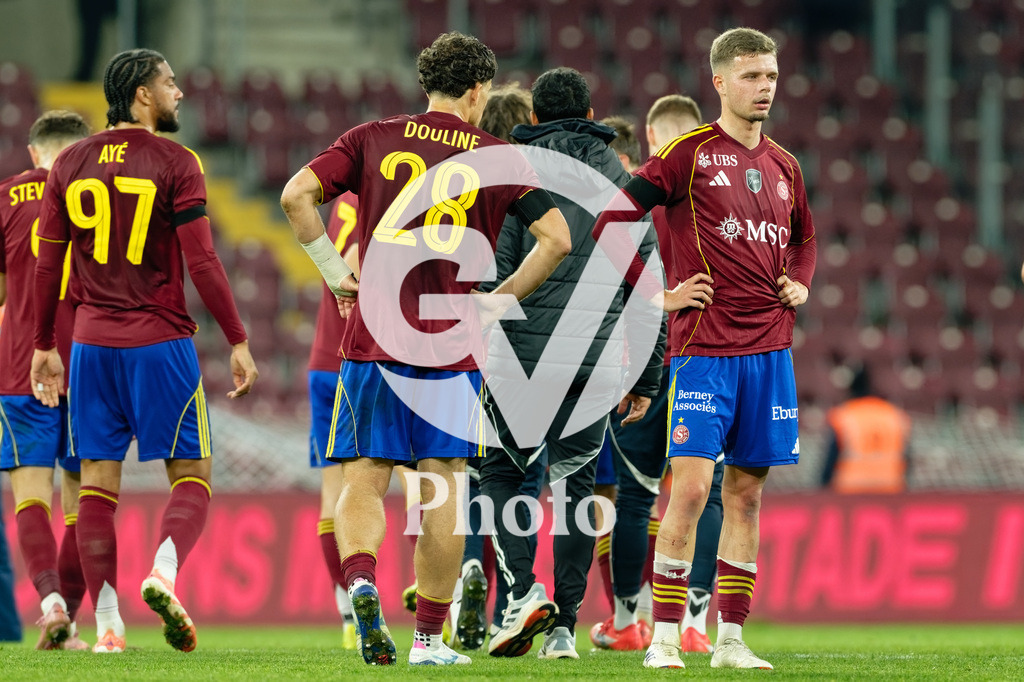 Brack Super League - Servette FC v FC Lausanne-Sport | Teo Alix (34 Servette FC) David Douline (28 Servette FC) Florian Aye (97 Servette FC) look dejected after losing  during the Brack Super League match between Servette FC and FC Lausanne-Sport at Stade de Geneve in Geneva, Switzerland
