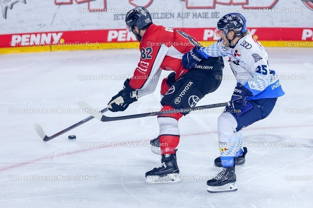 KEC1404251012 | 14.04.2025, Eishockey, DEL Play-offs, Kölner Haie - ERC Ingolstadt, Halbfinale Spiel 6, Lanxess-Arena Köln: Alexandre Grenier (Kölner Haie #82) im Zweikampf gegen Leon Hüttl (ERC Ingolstadt #25) 