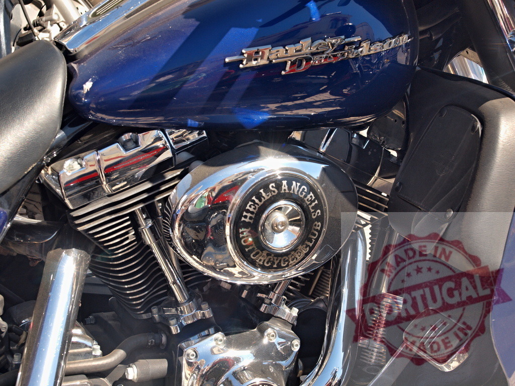 Harley Davidson motorcycle engine detail showing Hells Angels logo | Harley Davidson motorcycle engine with chrome air filter displaying the Hells Angels Motorcycle Club logo - Realized with Pictrs.com