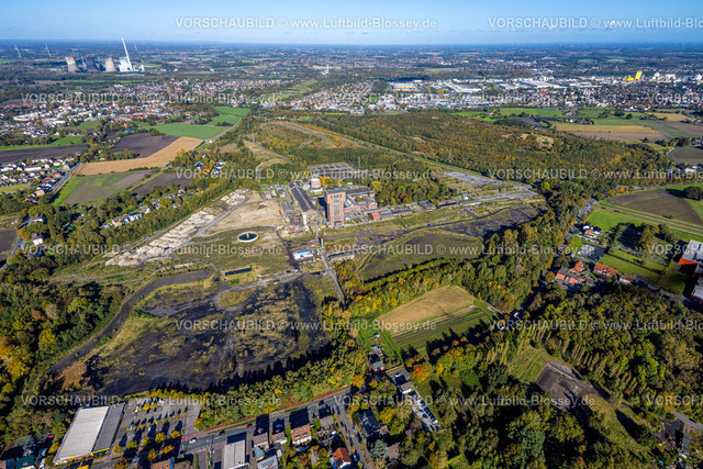 Hamm241007664 | Luftbild, ehemaliges Bergwerk Ost Heinrich Robert mit dem Hammerkopfturm, Neugestaltung zum CreativRevier Hamm, Halde Humbert, Fernsicht und blauer Himmel mit Wolken, Stadtbezirk Pelkum, Hamm, Ruhrgebiet, Nordrhein-Westfalen, Deutschland