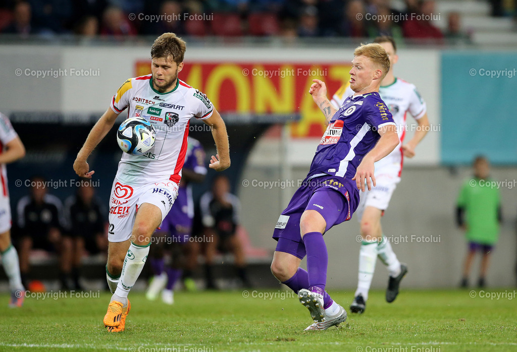 A_LUI_090823_13 | SPORT,FUSSBALL,ADMIRAL BUNDESLIGA AUSTRIA KLAGENFURT 09.08.2023 IM BILD:DOMINIK BAUMGARTNER (KLAGENGFURT) UND JONAS ARWEILER  (WAC) FOTO:FOTOLUI/MW