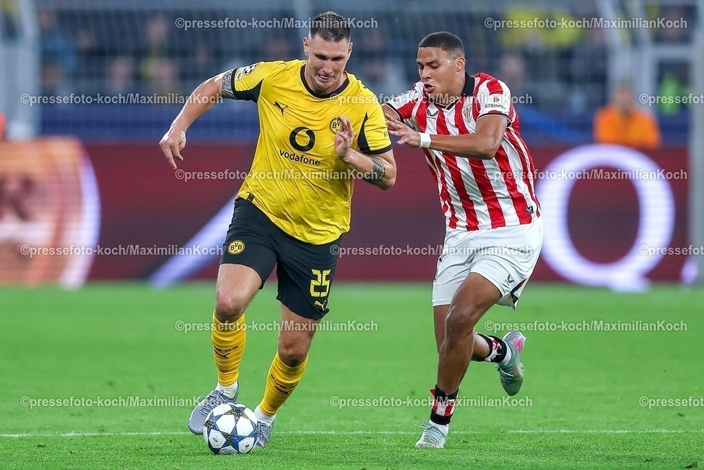 UCL01102501203 | 01.10.2025, Fußball, UEFA Champions League, Borussia Dortmund - Athletic Club Bilbao, BVB Stadion, 2. Spieltag, Saison 2025 2026: Niklas Süle (BVB #25)  im Zweikampf gegen  Maroan Sannadi (Bilbao #21) Regulations prohibit any use of photographs as image sequences and or quasi-video.