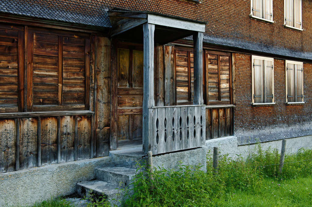 Detail eines Bregenzerwälderhauses | Schoenenbach, Austria - July 24, 2012: Vorsäßsiedlung Schönenbach;  Detail eines Bregenzerwälderhauses mit Eingang. - Realisiert mit Pictrs.com