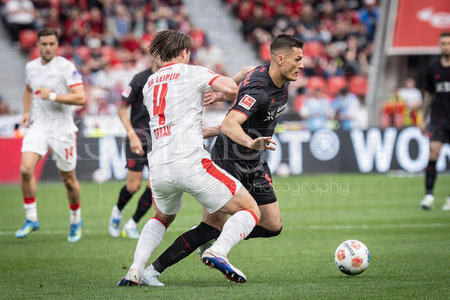 German Bundesliga, Bayer 04 Leverkusen vs. RB Leipzig, 02.05.2026 | LEVERKUSEN, GERMANY - MAY 2, 2026 :  Willi Orban (RB Leipzig, 4) tackles Patrik Schick (Bayer 04 Leverkusen, 14) during the German Bundesliga match on gameday 32 between Bayer 04 Leverkusen vs. RB Leipzig at BayArena on May 2, 2026 in Leverkusen, Germany. DFL REGULATIONS PROHIBIT ANY USE OF PHOTOGRAPHS AS IMAGE SEQUENCES AND/OR QUASI-VIDEO.