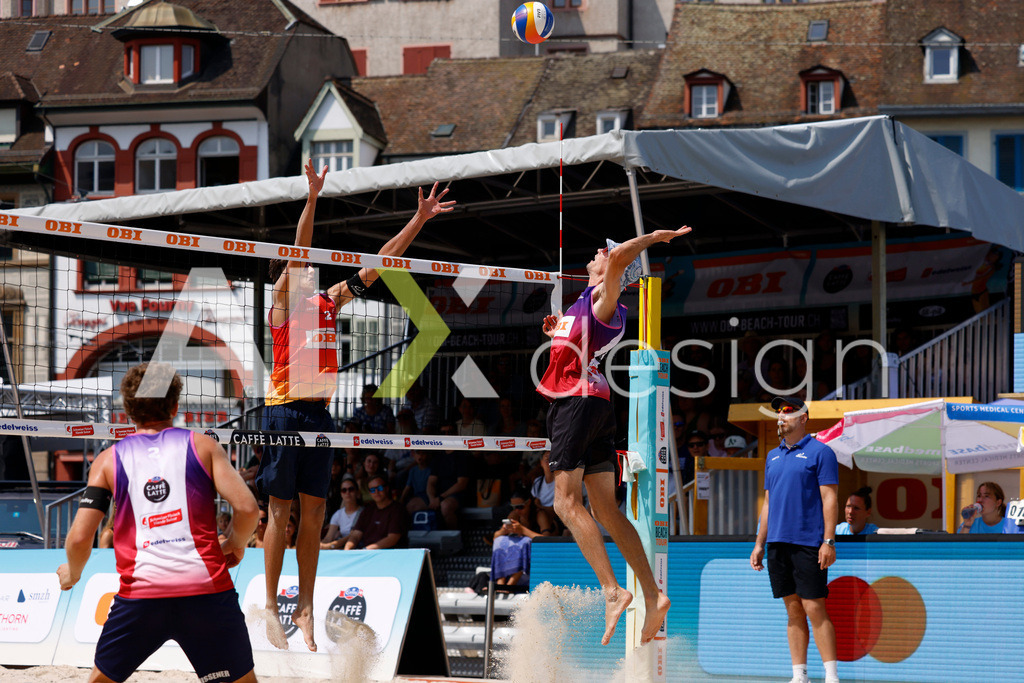 Obi BeachTour 2026 - Basel | BASEL, SWITZERLAND - JULY 19: SIMON HAGENBUCH (SUI) attack / spike against LUC EMANUEL FLÜCKIGER (SUI) block during the Obi BeachTour 2026 match between DILLIER / FLÜCKIGER (SUI) and HAGENBUCH / HAUSSENER (SUI) at Barfüsserplatz on July 19, 2026 in Basel, Switzerland. - Realisiert mit Pictrs.com