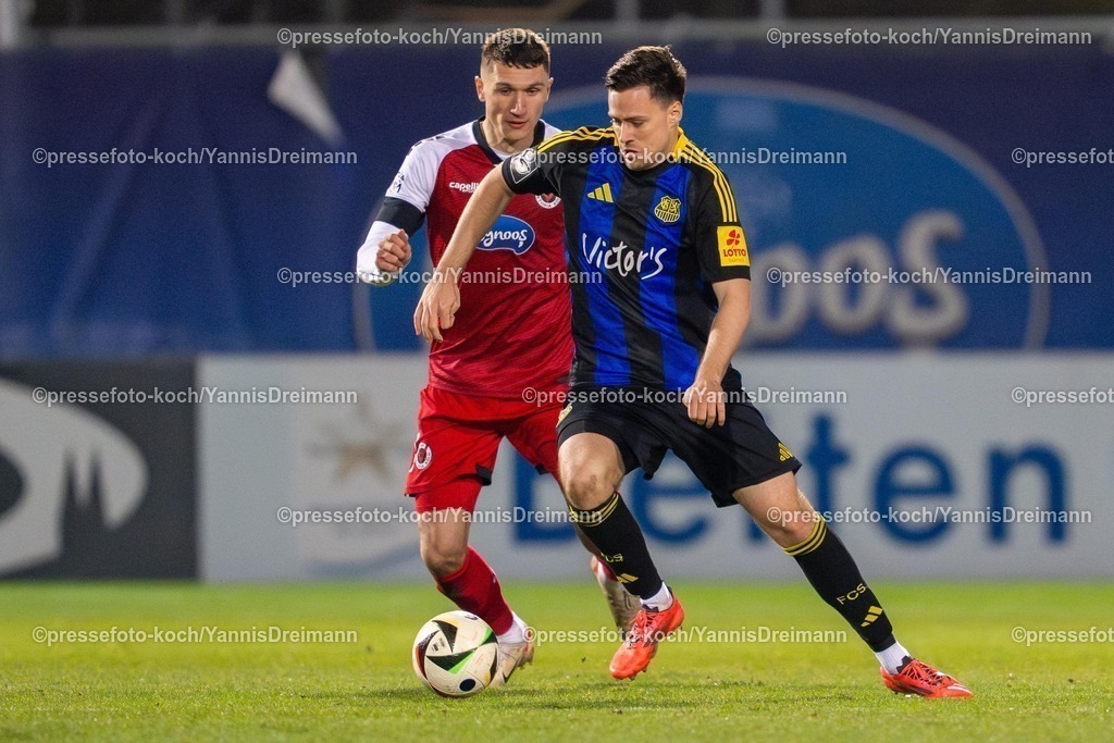 xYDR28022502090 | 28.02.2025, xydrx, Fußball, Viktoria Köln - 1.FC Saarbrücken, 3.Liga, Sportpark Höhenberg, Saison 2024 2025: Christoph Greger (Viktoria Köln #15) im Zweikampf mit Stefan Freitag (1.FC Saarbrücken #24). DFB regulations prohibit any use of photographs as image sequences and or quasi-video.