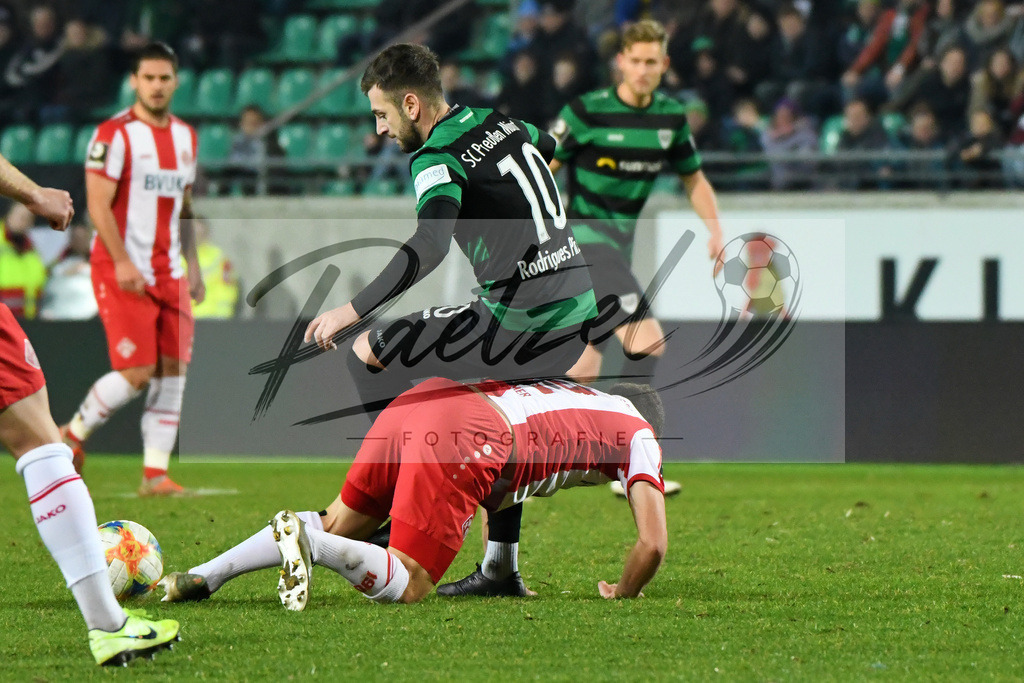 20200214_SCPFWK_0049 | Fussball, Herren: Kevin Rodrigues Pires (SC Preussen Muenster) und Patrick Sontheimer (FC Wuerzburger Kickers) im Zweikampf waehrend des Spiels der 3. Liga zwischen SC Preussen Muenster und FC Wuerzburger Kickers im Preussenstadion am 14.02.2020 in Muenster, Deutschland.DFB / DFL REGULATIONS PROHIBIT ANY USE OF PHOTOGRAPHS AS IMAGE SEQUENCES AND/OR QUASI-VIDEO. - Realisiert mit Pictrs.com