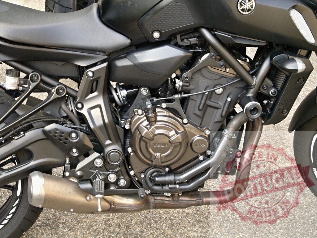 Powerful Yamaha MT-09 engine roaring for adventure | Close-up of a Yamaha MT-09 engine, highlighting its intricate details and robust design, ready for a thrilling ride - Realized with Pictrs.com