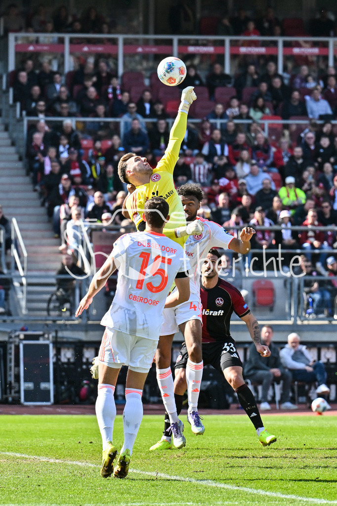 1. FC Nürnberg - Fortuna Düsseldorf | NUREMBERG, GERMANY - 07. MARCH:  Marcel Laurenz LOTKA (Fortuna Düsseldorf 1) kann hier eine Flanke der Hausherren weg fausten während dem Match zwischen dem 1. FC Nürnberg und Fortuna Düsseldorf am 25. Spieltag der 2. Bundesliga im Max Morlock Stadion