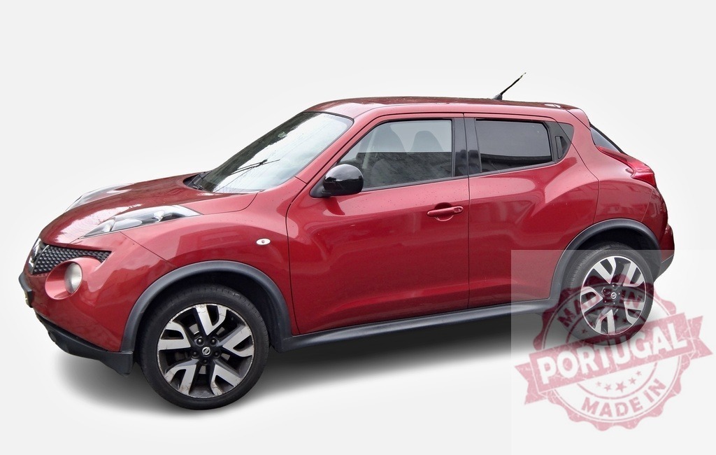 Red Nissan Juke posing on a white background | Shiny red Nissan Juke crossover SUV is parked on a white background - Realized with Pictrs.com