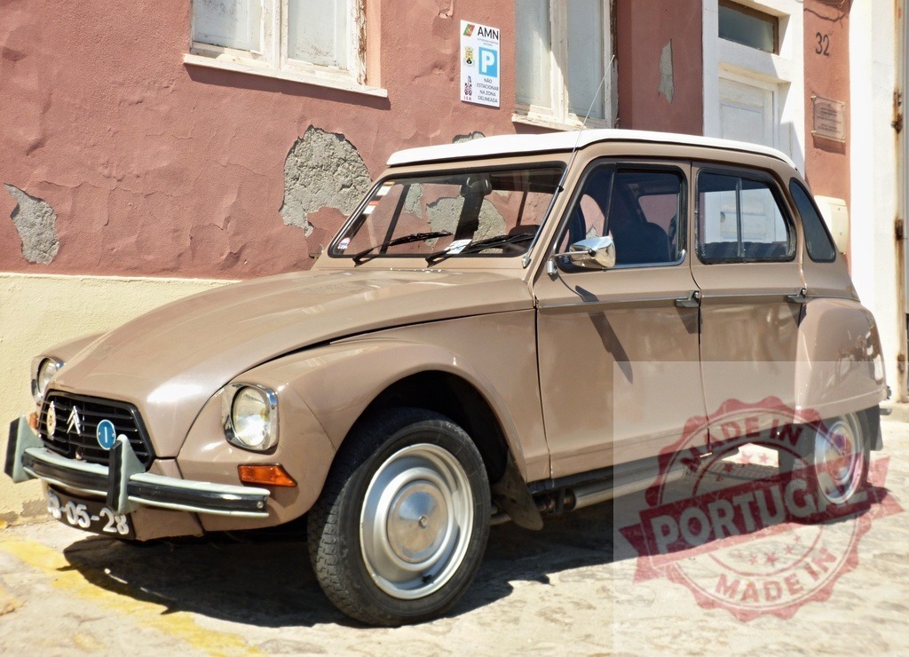 Citroën Dyane parked near a pink wall showing peeling paint | Classic Citroën Dyane car parked near a weathered pink wall in urban setting, showcasing vintage automotive design - Realized with Pictrs.com