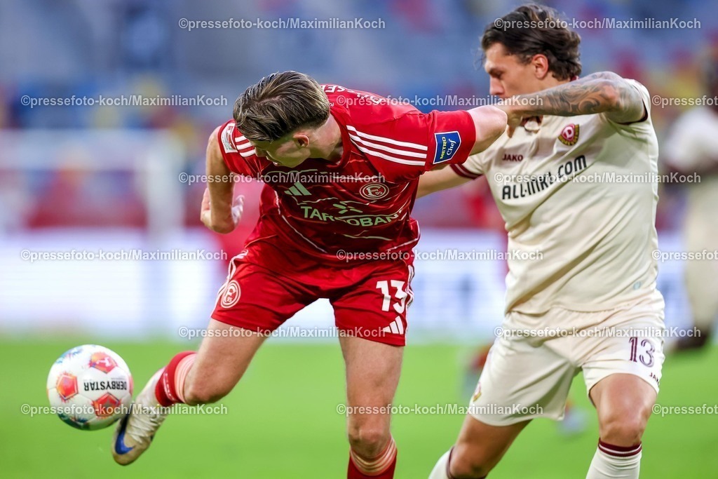 F9524042601047 | 24.04.2026, Fußball, Fortuna Düsseldorf - SC Dynamo Dresden, 2. Fußball Bundesliga, Herren, Merkur Spiel-Arena, 31. Spieltag, Saison 2025 2026: Cedric Itten&nbsp;(Fortuna Düsseldorf #13) im Zweikampf gegen  Julian Pauli (Dynamo Dresden #13)  DFB regulations prohibit any use of photographs as image sequences and or quasi-video.