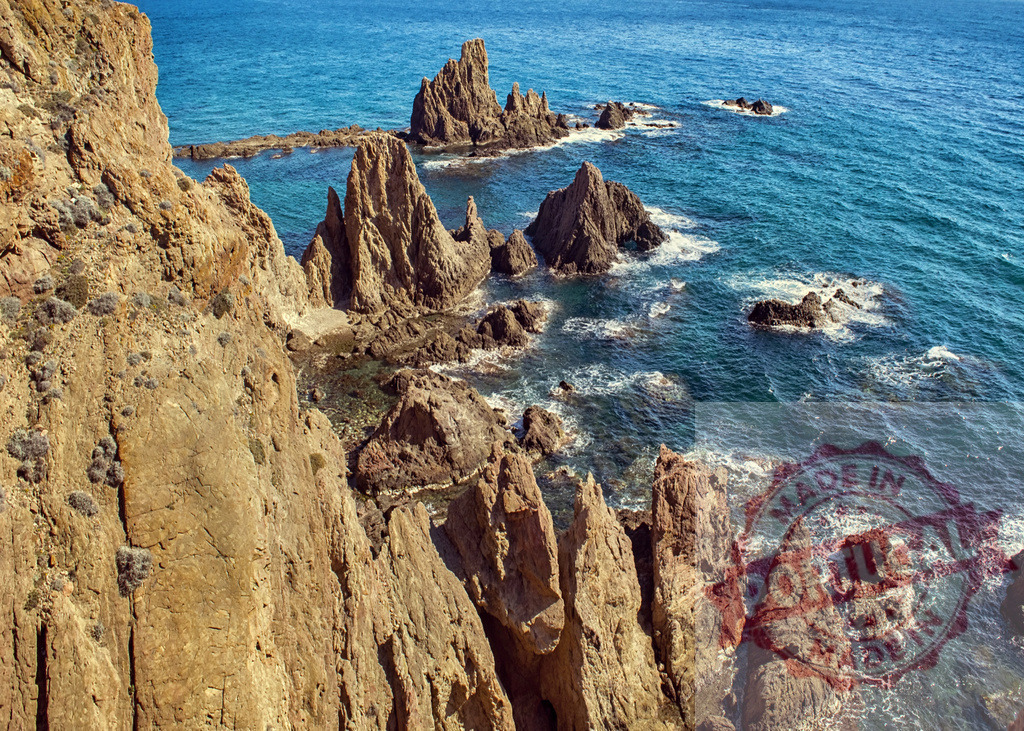 Rocky sea stacks in Cabo de Gata-Níjar Natural Park | Rugged coastline with dramatic rock formations and clear blue Mediterranean Sea - Realisiert mit Pictrs.com