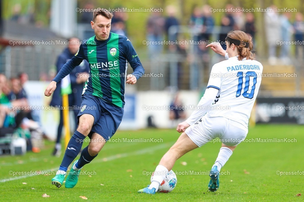 xKWIx12042601018 | 2026.04.12, xkwix, Fußball, Regionalliga West, FC Gütersloh -  SC Paderborn 07 II, Heidewaldstadion (Ohlendorf Stadion im Heidewald), 29.Spieltag, Saison 2025 / 2026: Fynn Arkenberg (FC Gütersloh #33) im Zweikampf gegen Bennit Broeger (SC Paderborn II #10) DFB regulations prohibit any use of photographs as image sequences and or quasi-video. Photo: xKamilxWilkowskixPressefotoKochx