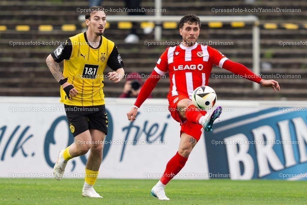 xydr13042502006 | 13.04.2025, xydrx, Fußball, Borussia Dortmund II - FC Energie Cottbus, 3.Liga, Stadion Rote Erde, Saison 2024 2025: Tony Reitz (Borussia Dortmund II #36) Yannik Moeker (FC Energie Cottbus #21) DFB regulations prohibit any use of photographs as image sequences and or quasi-video.