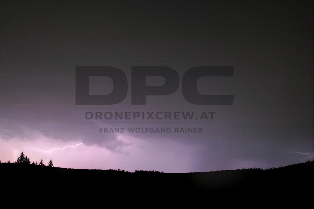Lightning Storm over the Almenland | Multiple lightning strikes illuminate the night sky over the Almenland region in Austria during a powerful summer thunderstorm. - Realisiert mit Pictrs.com