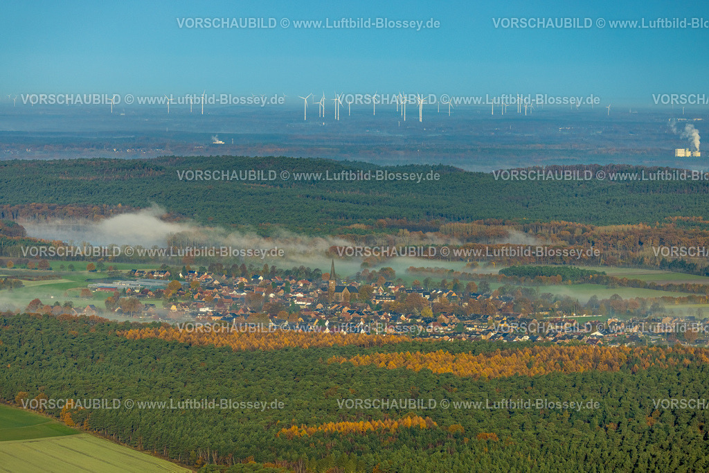 Haltern231104052 | Luftbild, Nebelschwaden über dem Ort Hullern mit der St. Andreas Kirche, hinten Windräder Park, umgeben von herbstlichen Laubbäumen, Hullern, Haltern am See, Ruhrgebiet, Münsterland, Nordrhein-Westfalen, Deutschland