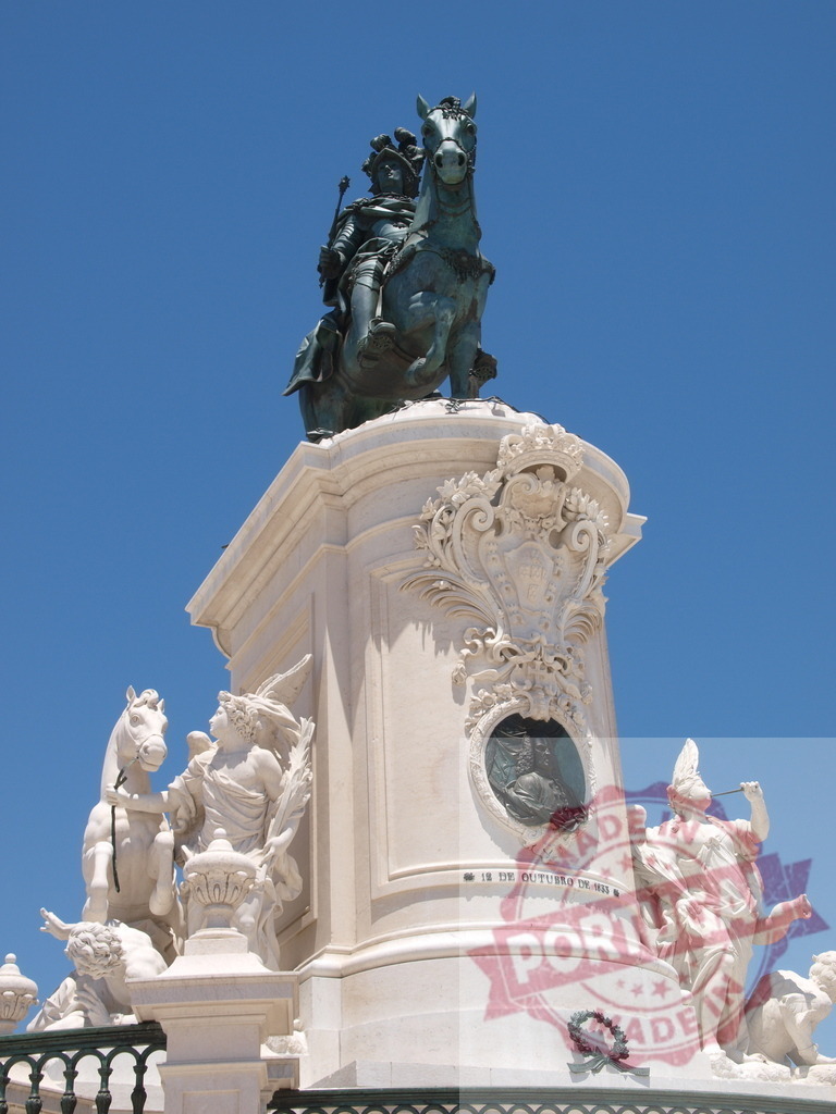 King Joseph I equestrian statue in Praça do Comércio. Lisbon - Portugal | Joseph I equestrian statue standing on a decorative pedestal against a clear blue sky - Realized with Pictrs.com