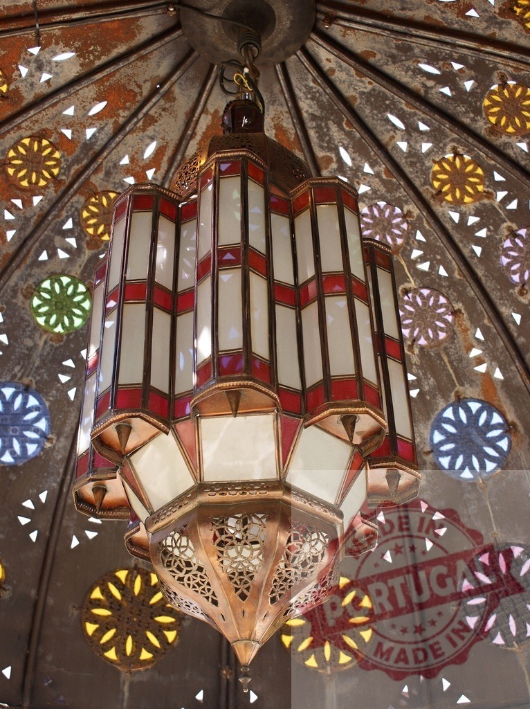 Moroccan lantern hanging from a patterned ceiling | Ornate Arabic style lantern with glass details hanging from a decorative ceiling - Realized with Pictrs.com