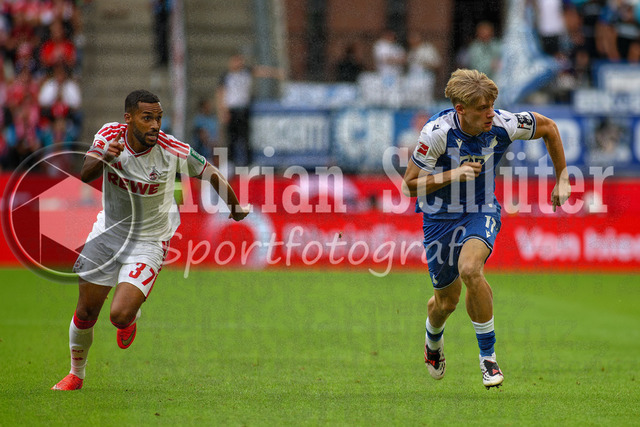 29.08.2026, GER, Fussball, Herren, Bundesliga , 1. Bundesliga, Saison 2026/2027, 1. FC Köln - TSG 1899 Hoffenheim | Linton Maina (KOE) und Nathan De Cat (TSG) im Kampf um den Ball