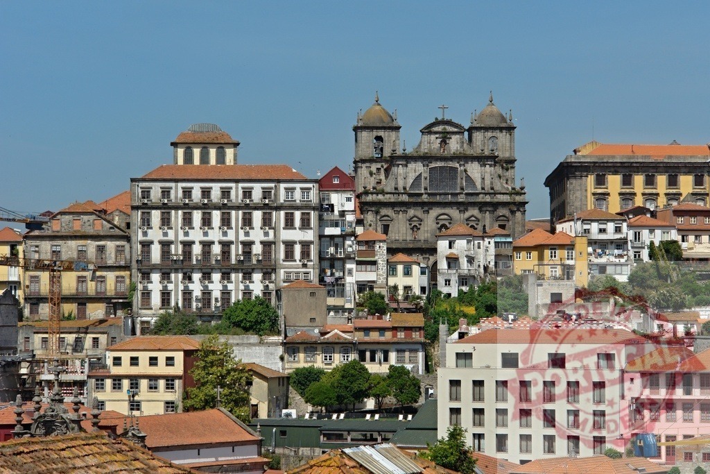 Porto historic center showing cityscape and architecture | Porto cityscape with historic buildings and São Bento da Vitória Church under a clear blue sky - Realized with Pictrs.com