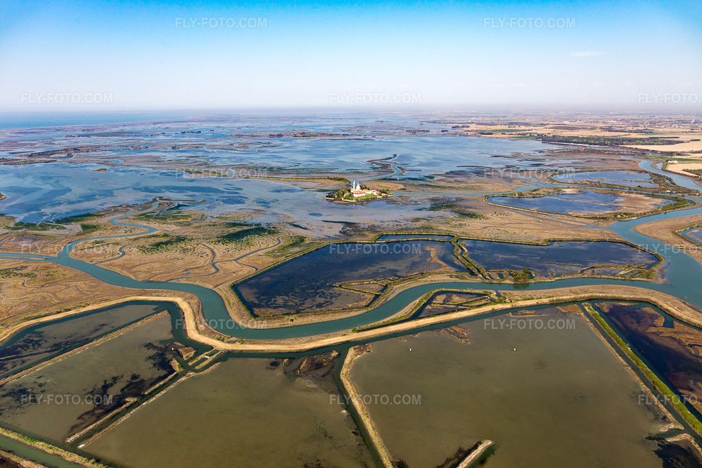 Aerial view: Adriatic island in the Lido of Grado with monastery Santuario Di Barbana near Grado in the district Santuario Di Barbana in Grado in the state Gorizia, Italy.Photo: IMG_098094.jpg taken on 04/03/2017 by Werner Riehm/FLY-FOTO.comResolution of the original: 5472 x 3648 px
