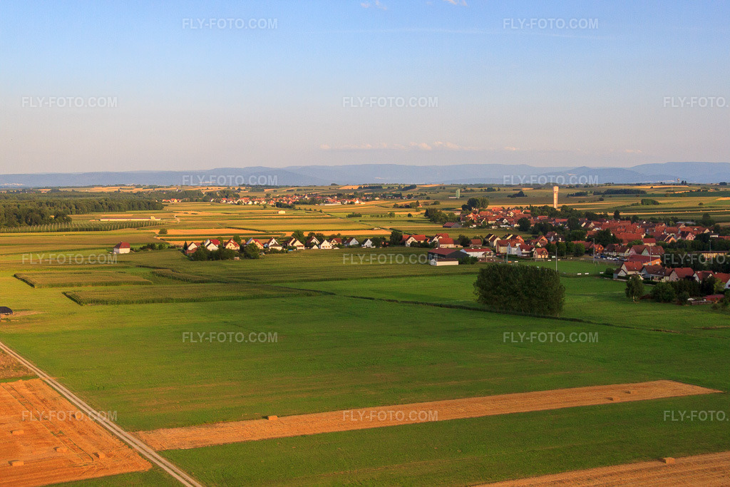 Aerial view: Rue de la Gare in Schleithal in the state Bas-Rhin, France. – Photo: IMG_59021.jpg taken on 08/04/2013 by Werner Riehm/FLY-FOTO.com – Resolution of the original: 4752 x 3168 px