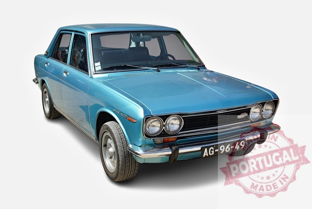 Blue Datsun 510 classic vintage sedan car | Datsun 510 sedan car displaying its classic vintage design on a white background - Realized with Pictrs.com