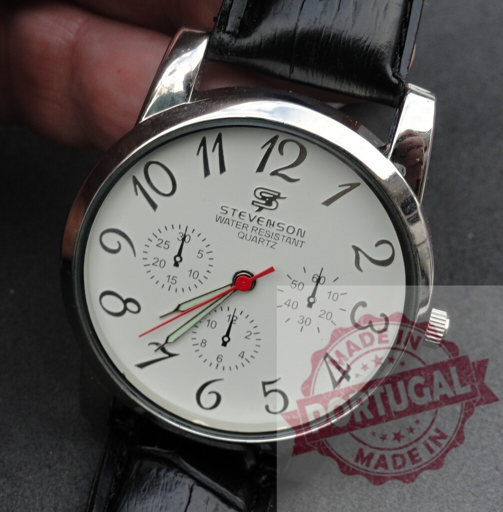 Stevenson analog chronograph watch displaying time on wrist | Stevenson quartz watch with black leather strap showing time - Realisiert mit Pictrs.com