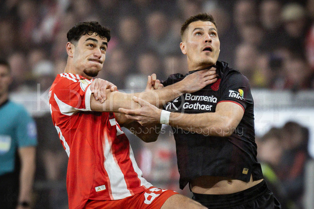 DFB Cup semifinal match Bayer 04 Leverkusen vs. FC Bayern Munich, 22.04.2026 | LEVERKUSEN, GERMANY - APRIL 22, 2026: Aleksandar Pavlovic (FC Bayern Muenchen, 45) and Patrik Schick (Bayer 04 Leverkusen, 14) tackling during the German DFB Cup semifinal match between Bayer 04 Leverkusen vs. FC Bayern Munich at BayArena on April 22, 2026 in Leverkusen, Germany. DFL REGULATIONS PROHIBIT ANY USE OF PHOTOGRAPHS AS IMAGE SEQUENCES AND/OR QUASI-VIDEO.