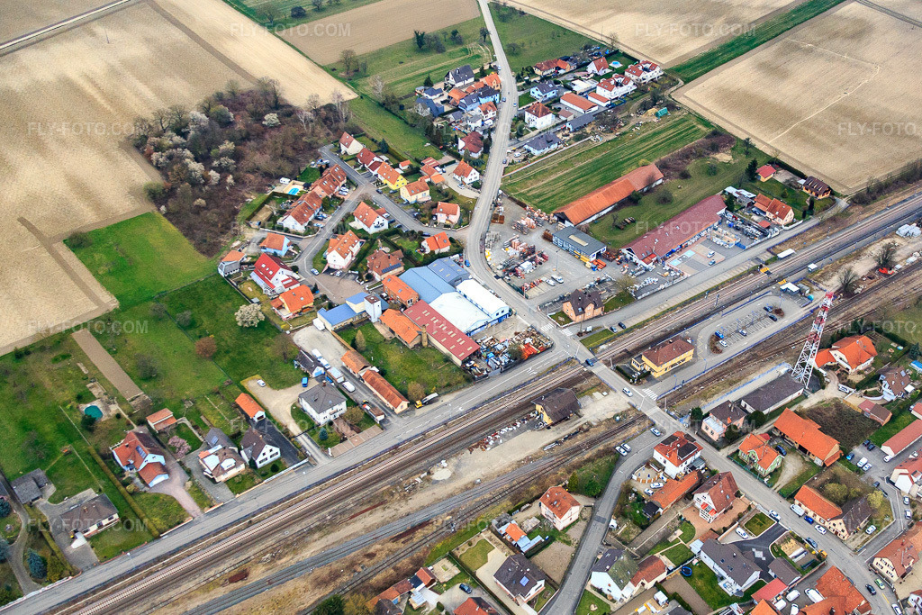 Aerial view: Railroad station in Rœschwoog in the state Bas-Rhin, France. – Photo: IMG_086637.jpg taken on 03/19/2016 by Werner Riehm/FLY-FOTO.com – Resolution of the original: 4403 x 2935 px