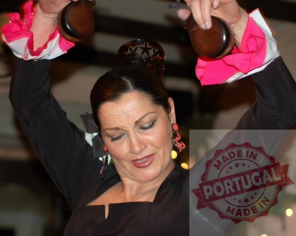 Flamenco dancer performing with castanets, showing emotion | Female flamenco dancer performing with passion, playing traditional Spanish castanets during a show - Realisiert mit Pictrs.com