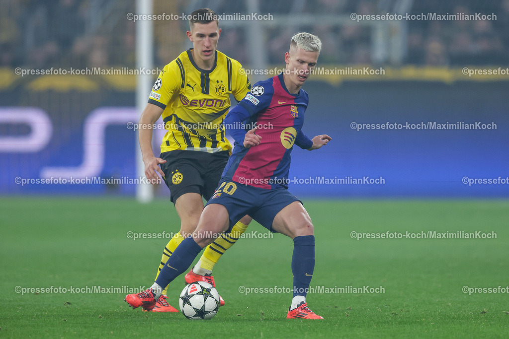 UCL11122401001 | 11.12.2024, UEFA Champions League, Borussia Dortmund - FC Barcelona, 8. Spieltag, Signal Iduna Park, Saison 2024 2025: Nico Schlotterbeck (BVB #4) im Zweikampf gegen Dani Olmo (Barca #20)