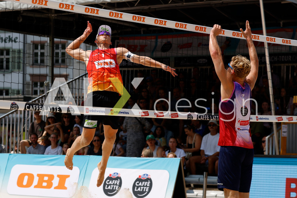 Obi BeachTour 2026 - Basel | BASEL, SWITZERLAND - JULY 19: LAURENZ LEITNER (AUT) attack / spike against MATHIS KÄLIN (SUI) block during the Obi BeachTour 2026 match between LEITNER / KINDL (AUT) and BREER / KÄLIN (SUI) at Barfüsserplatz on July 19, 2026 in Basel, Switzerland. - Realisiert mit Pictrs.com