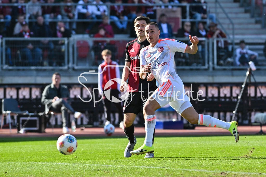 1. FC Nürnberg - Fortuna Düsseldorf | NUREMBERG, GERMANY - 07. MARCH:  im Duell Tom BAACK (1. FC Nuernberg 5) und Marin LJUBICIC (Fortuna Düsseldorf 20) während dem Match zwischen dem 1. FC Nürnberg und Fortuna Düsseldorf am 25. Spieltag der 2. Bundesliga im Max Morlock Stadion / DFL REGULATIONS PROHIBIT ANY USE OF PHOTOGRAPHS AS IMAGE SEQUENCES AND/OR QUASI-VIDEO