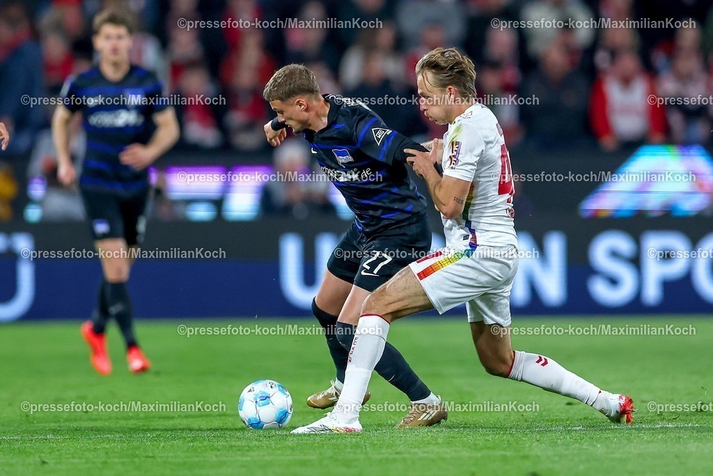 1FC05042501031 | 05.04.2025, Fußball, 1. FC Köln - Hertha BSC, 2.. Fußball Bundesliga, 28. Spieltag, RheinEnergie-STADION, Saison 2024 2025: Michael Cuisance (Hertha BSC #27) im Zweikampf gegen Mathias Olesen (FC Koeln #47) DFB regulations prohibit any use of photographs as image sequences and or quasi-video.
