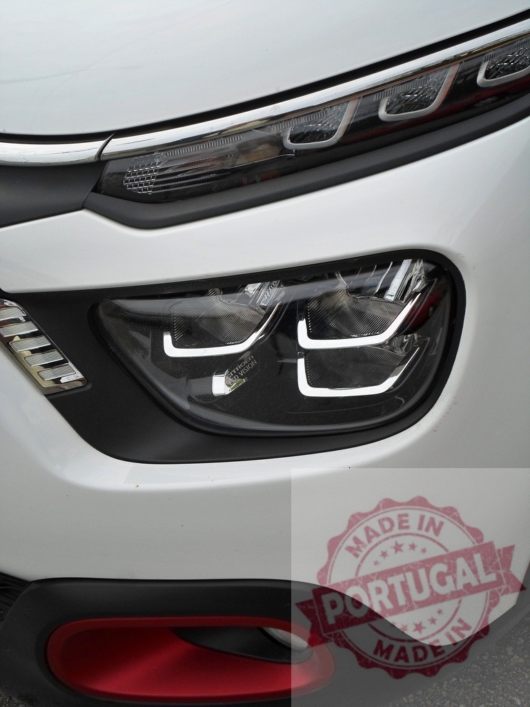 Citroen C3 Aircross LED headlight detail showing modern design | Citroen C3 Aircross front light detail featuring LED technology and red accent - Realisiert mit Pictrs.com