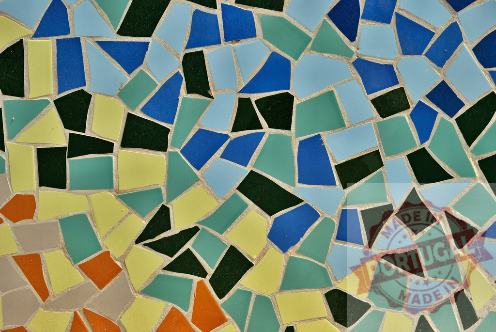 Colorful mosaic tiles creating a vibrant and textured surface | Mosaic tiles in various colors and shapes forming an intricate pattern, suitable for backgrounds and design projects - Realized with Pictrs.com