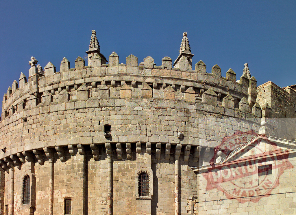 Avila Cathedral apse and Cimorro tower in Spain. Spain - Avila | Avila Cathedral apse showing Romanesque and Gothic architectural styles under a blue sky - Realized with Pictrs.com