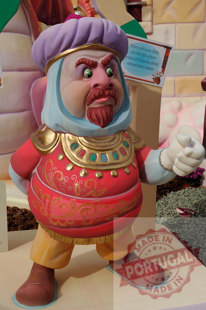 Fallas festival character representing an angry sultan | Colorful Fallas figure depicting an angry Middle Eastern sultan during a outdoor festival - Realized with Pictrs.com