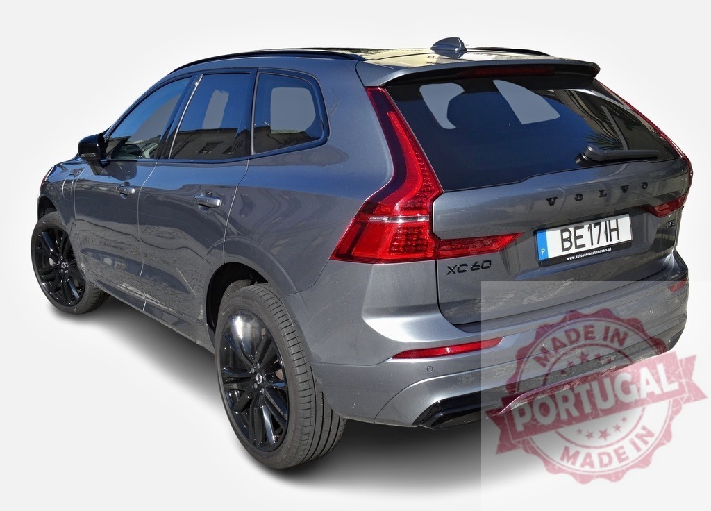 Volvo XC60 showcasing its elegant rear design, parked on a bright day | Modern gray Volvo XC60 highlighting its sleek design and black rims, parked in a well-lit area - Realized with Pictrs.com