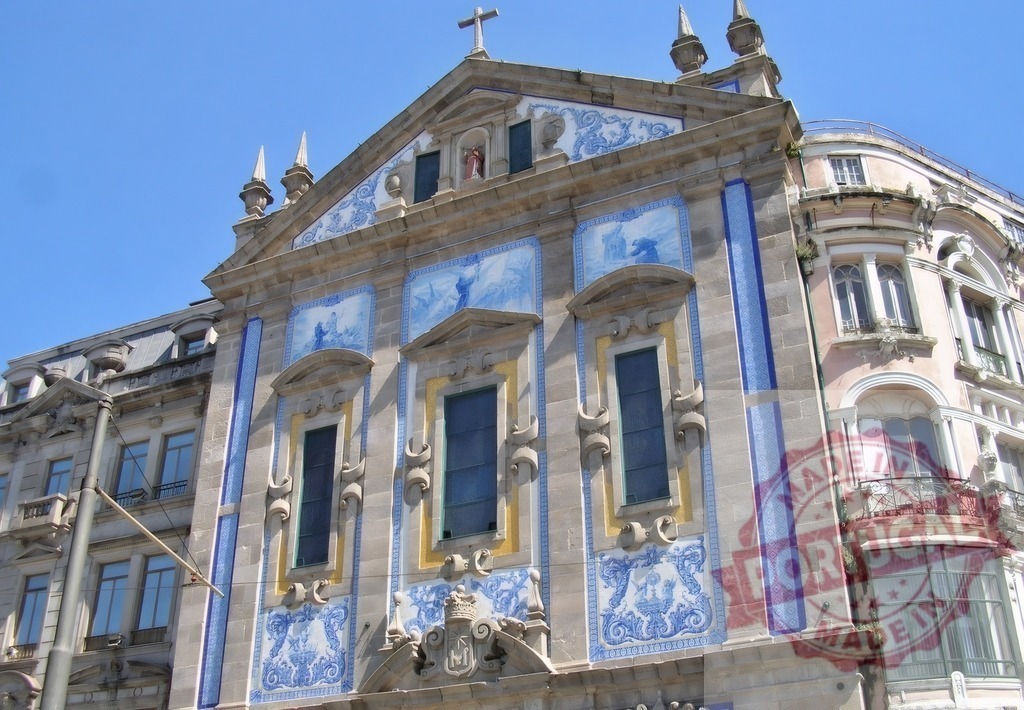 Igreja de Santo Ildefonso facade featuring historic azulejo tiles | Igreja de Santo Ildefonso facade showcasing traditional blue and white azulejo artwork in Porto - Realisiert mit Pictrs.com