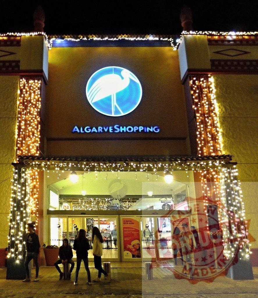 AlgarveShopping mall entrance decorated with christmas lights at night | AlgarveShopping main entrance decorated with christmas lights, Guia, Albufeira, Portugal - Realized with Pictrs.com