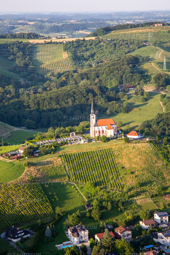 Aerial view: Gorca Church - Marijina cerkev v Malečniku in the district Malečnik in Maribor in the state Slovenia, Slovenia. – Photo: IMG_137396.jpg taken on 07/08/2023 by Werner Riehm/FLY-FOTO.com – Resolution of the original: 3648 x 5472 px