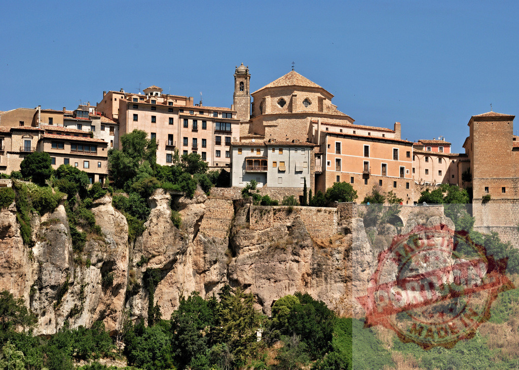 Cuenca town houses built on the clifftop. Cuenca - Spain | Cuenca's old town featuring unique Casas Colgadas, historic architecture on rocky cliffs under a clear sky - Realisiert mit Pictrs.com