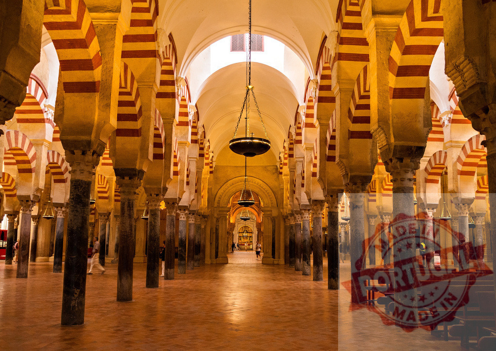 Mezquita Cathedral interior showing columns and arches in Cordoba, Spain. Spain - Cordoba | Rows of striped arches and columns filling the vast interior of the Mosque-Cathedral of Cordoba - Realized with Pictrs.com