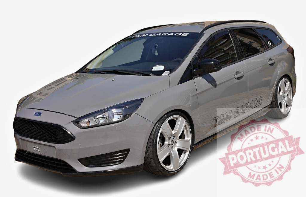 Customized Ford Focus Station Wagon showcasing tuning modifications | Gray tuned Ford Focus station wagon parked, demonstrating aftermarket parts and modifications - Realized with Pictrs.com