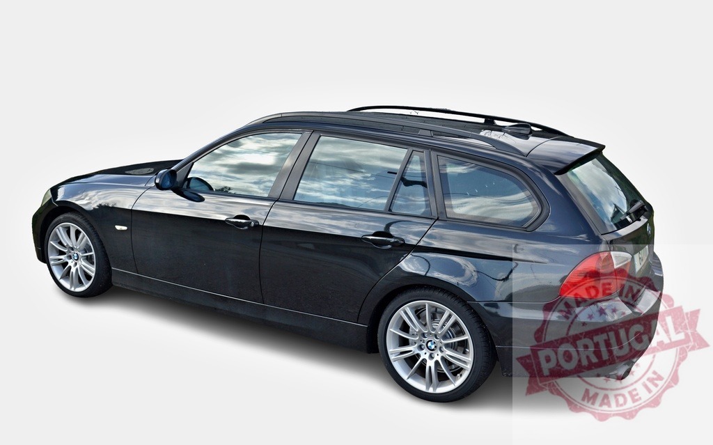 Black BMW 3 series touring car parked on white background | Studio shot of a black BMW series 3 touring car on a white background, showcasing its sleek design and elegance - Realized with Pictrs.com